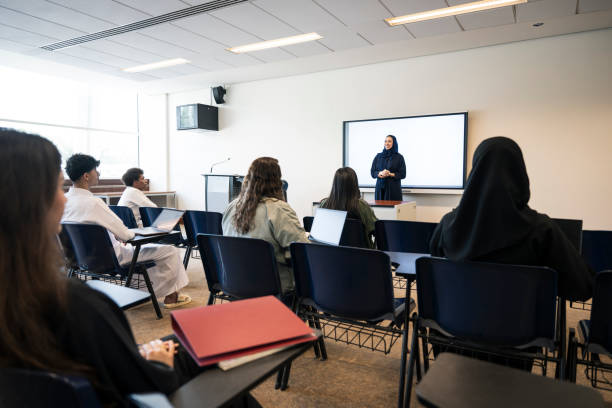 View from behind university students in Riyadh classroom, Saudi Arabia.